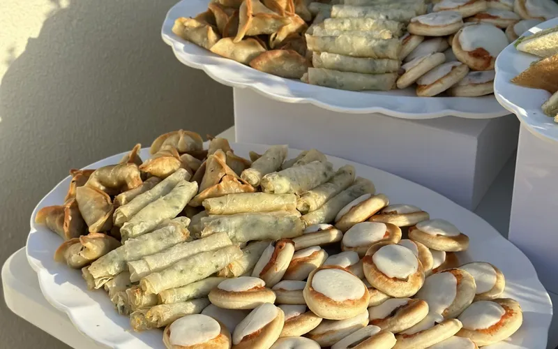 La Tavola catering buffet with mini pastries in a Beirut garden